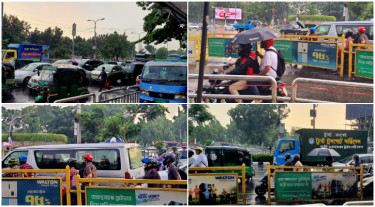 হঠাৎ বৃষ্টিতে রাজধানীতে ভোগান্তি, ভিজেই দায়িত্ব পালন ট্রাফিক পুলিশের